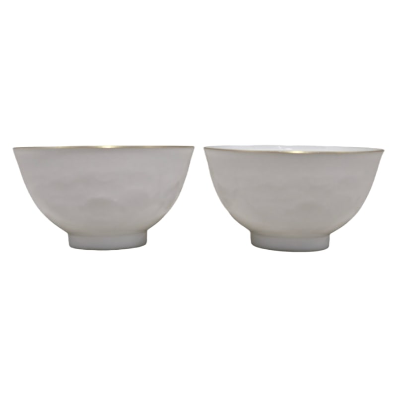 QING DYNASTY, YONGZHENG EMPEROR'S IMPERIAL MARK THIN-WALLED WHITE-GLAZED CUP WITH AUSPICIOUS PATTERN: It is 5 cm high and 8.8 cm in diameter.