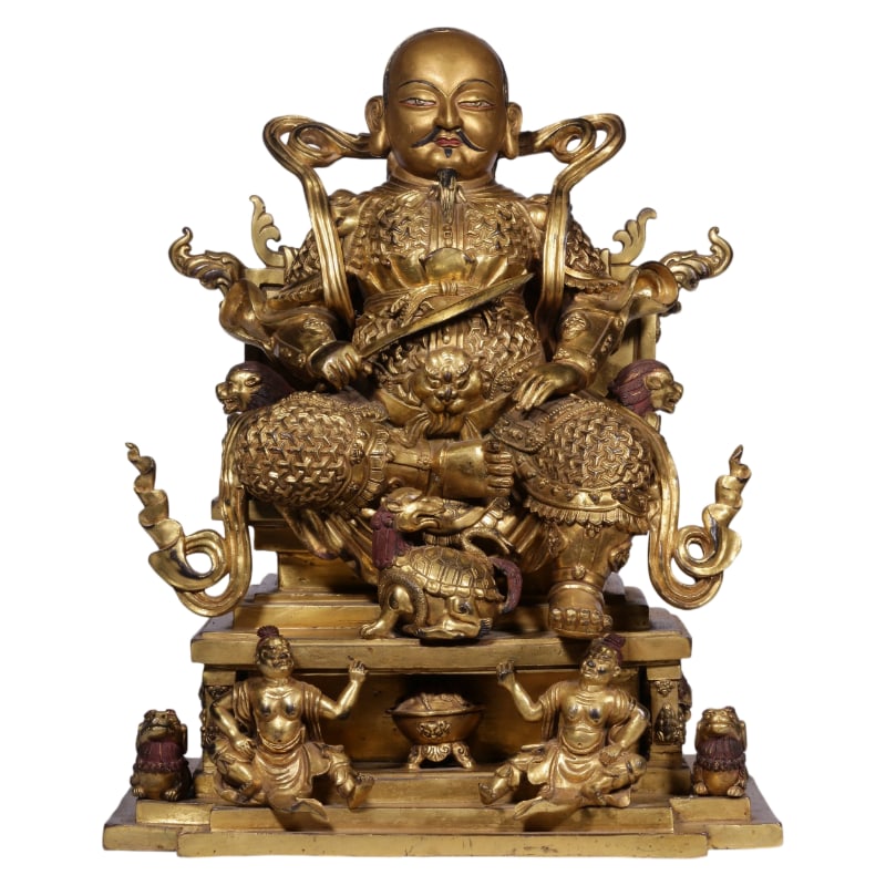A GILT BRONZE STATUE OF ZHENWU THE GREAT FROM THE QING DYNASTY.: It is 40 cm high, 32 cm long, 22 cm wide, and weighs 39.7 catties.