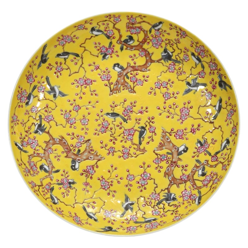 FAMILLE ROSE YELLOW GROUND MAGPIE ON PLUM BLOSSOM PLATE: 22.5 cm in diameter