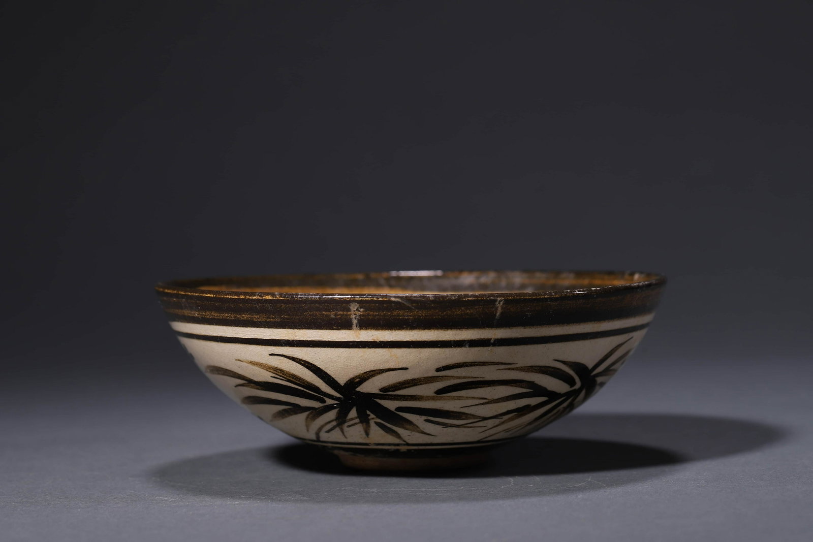 A Cizhou Kiln Flower Bowl: A Cizhou Kiln Flower Bowl Width:16cm, Height:5.8cm, Detailed condition reports are not included in this catalog. For additional information, including condition reports, please contact us at info@miwa