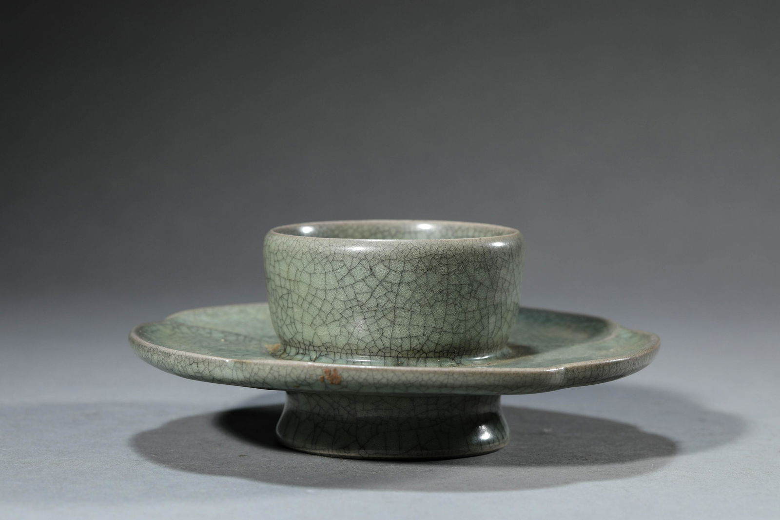 Guan Type Celadon Tea Cup and Cup Stand: Guan Type Celadon Tea Cup and Cup Stand ?窯?釉? Diam.16.5cm, Height:7cm, Detailed condition reports are not included in this catalog. For additional information, including condition report