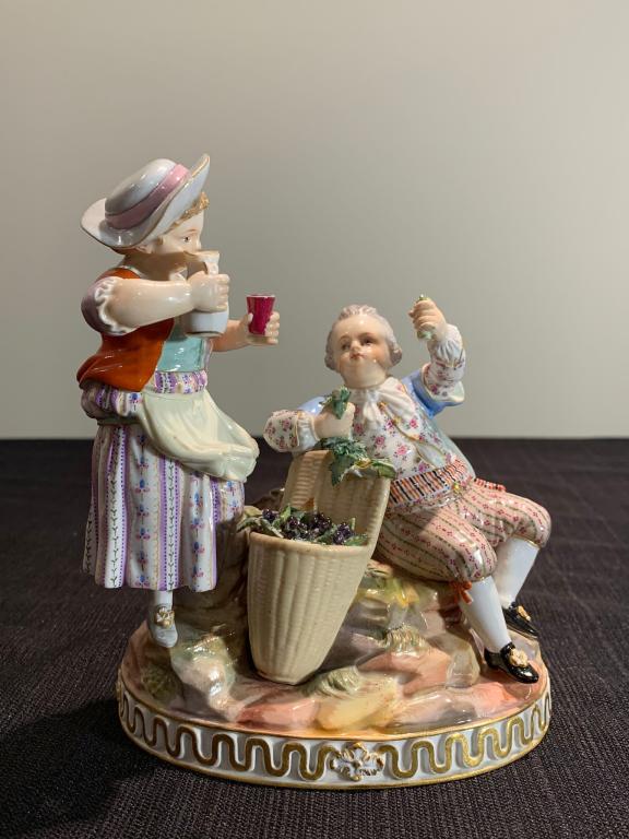 Antique Meissen Statue of Girl and Boy w/ Mark: Antique Meissen Statue of Girl and Boy w/ Mark of Blue Swords crossing. The production number is included on the item, dated 1870. There is a couple of small chips on the leaves. The width is 12cm, th