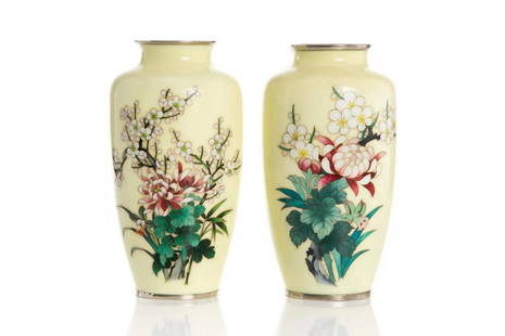 PAIR OF JAPANESE YELLOW CLOISONNE VASES.: Each with pale yellow ground, having white plum blossoms and pink peonies with green leaves, metal mouth and foot rims. H. 21.2 cm. (8 1/4 in. great condition