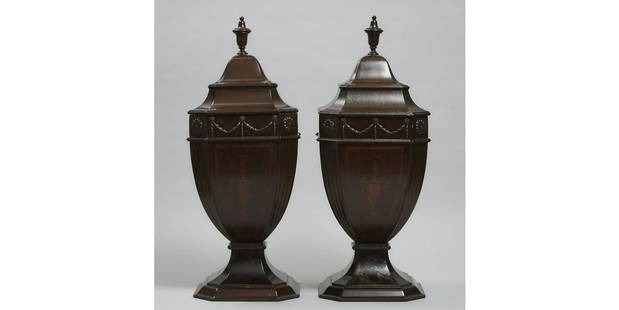 A LARGE PAIR OF EDWARDIAN MAHOGANY AND SATINWOOD: Large Pair of Adam Style Mahogany Knife Urns, 20th century each with canted and fluted corners, and applied relief decoration. height 28.25 in ? 71.8 cm.