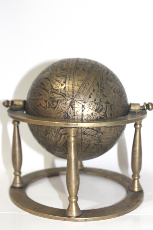 Antique bronze astrolabe hand made This vintage piece tells the story of the universe, with global: This vintage piece tells the story of the universe, with global zodiac symbols of astrology and a map of the heavens. Circumference 17cm(6.7in).