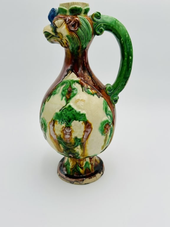 A SANCAI-GLAZED PHOENIX-HEADED EWER TANG DYNASTY A SANCAI-GLAZED PHOENIX-HEADED EWER TANG DYNASTY (1 of 2)