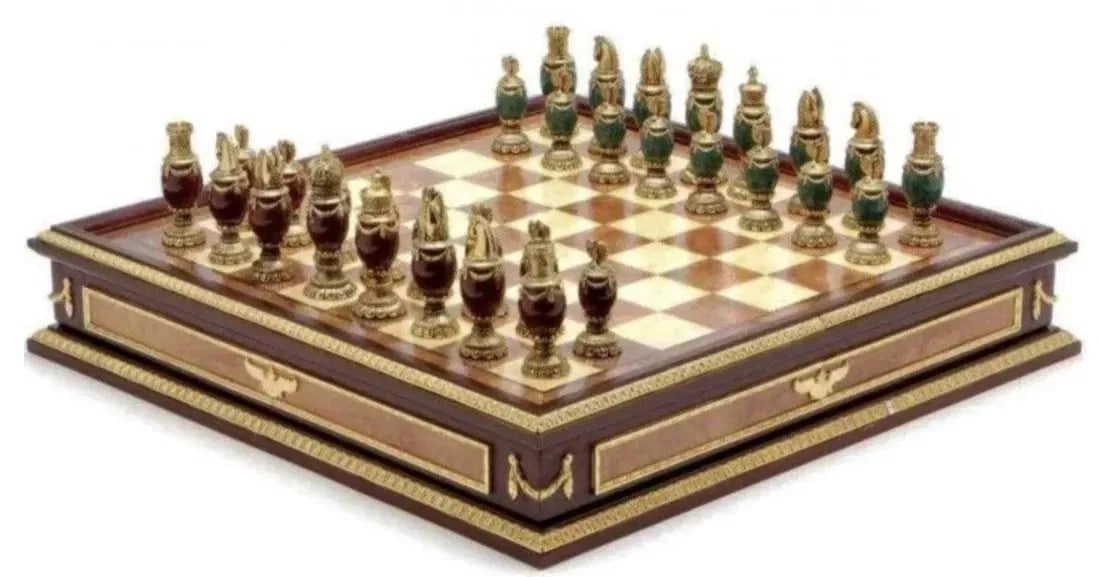 IMPERIAL FABERGE JEWELLED AND ENAMEL CHESS SET: MPERIAL FABERGE JEWELLED AND ENAMEL CHESS SET consisting of green and burgundy jeweled body chess set with 24k gold plated headpieces, inspired by the jeweled eggs of Faberge, produced by the Franklin