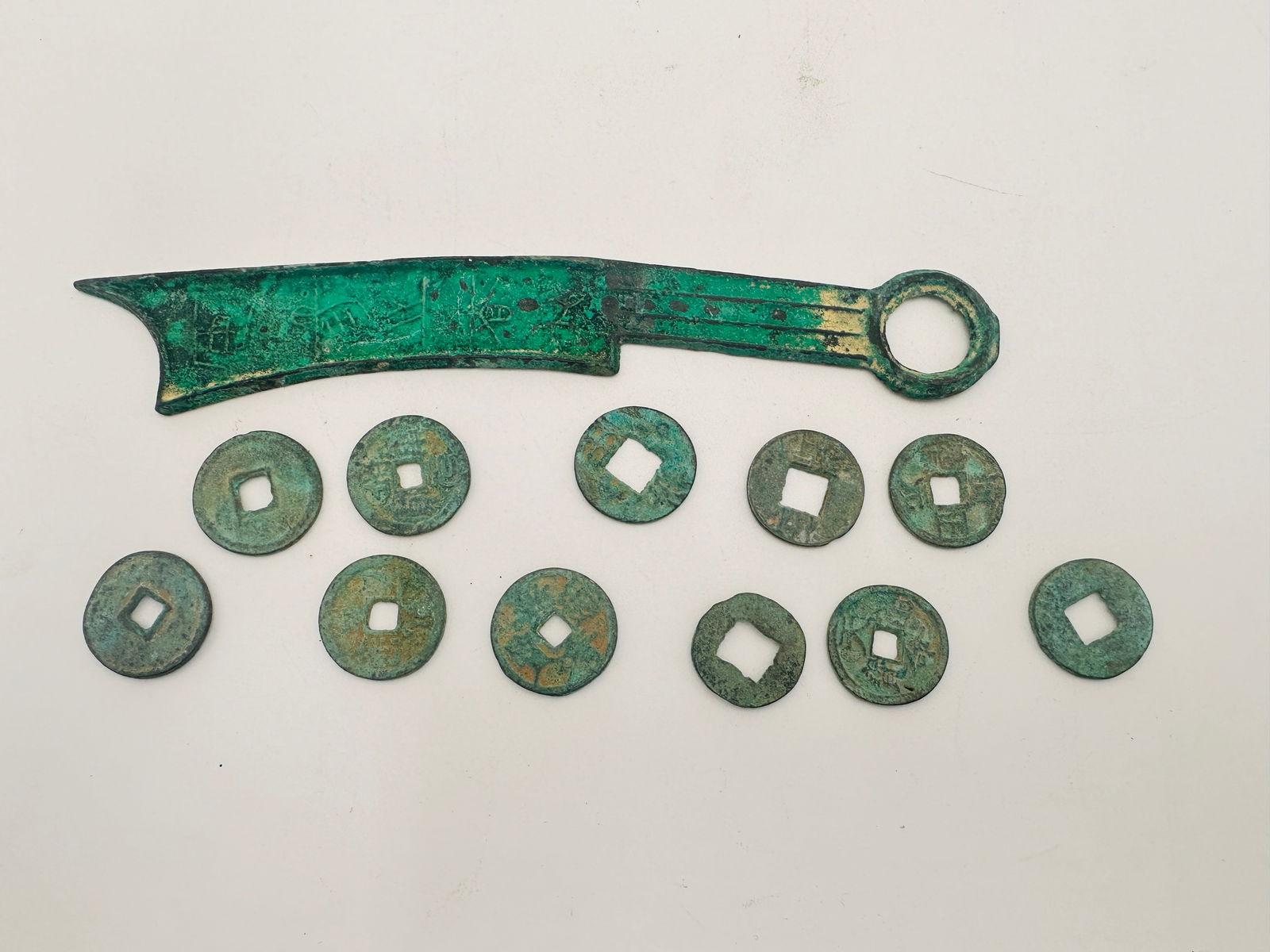 Collection of 12 Ancient Chinese Bronze Coins, Including Knife Money This lot features an impressive (1 of 3)