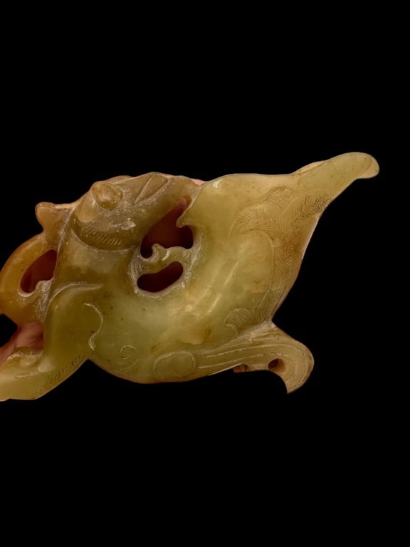 Chinese Hand Carved Jade Phoenix Amulet: Chinese Carved Jade Ornament – Chilong and Phoenix Design A beautifully carved Chinese jade ornament, likely from the Qing Dynasty or in that style, featuring an abstract representation of a chilong