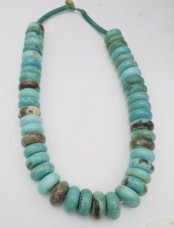 Turquoise Bead Necklace A striking strand composed of large graduated turquoise disc beads, each (1 of 2)