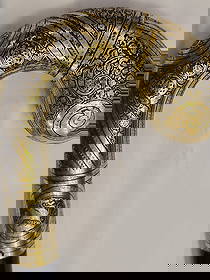 Spanish Damascened Cane walk Handle, Toledo, 19th Century: n elegant Toledo damascened walking cane handle, finely decorated in gold and silver inlay over a darkened steel or brass ground, featuring intricate arabesque and floral scroll motifs typical of the