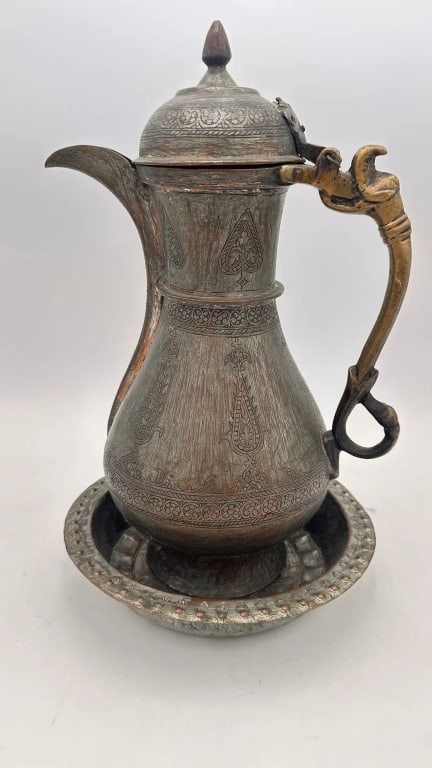 An Ottoman copper ewer and basin, 19th An Ottoman copper ewer and basin, 19th century. Of baluster (1 of 3)