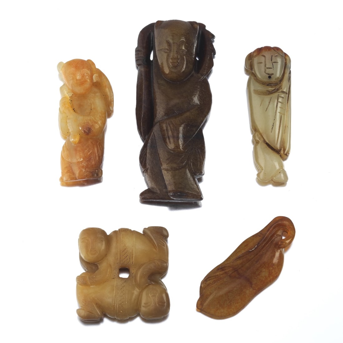 A Group of Five Carved Jade Ornaments A fine group of five Chinese jade and hardstone carvings, (1 of 8)
