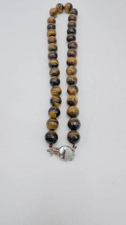 Tiger?s Eye Bead Necklace A striking necklace composed of large faceted tiger?s eye beads, each (1 of 2)