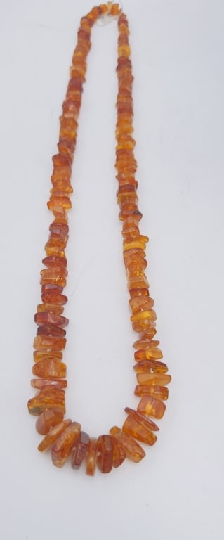 Baltic Amber Bead Necklace A beautiful necklace composed of natural amber beads in rich honey and: A beautiful necklace composed of natural amber beads in rich honey and cognac tones, arranged in graduated irregular nugget forms. The amber displays warm translucency with natural inclusions that cap