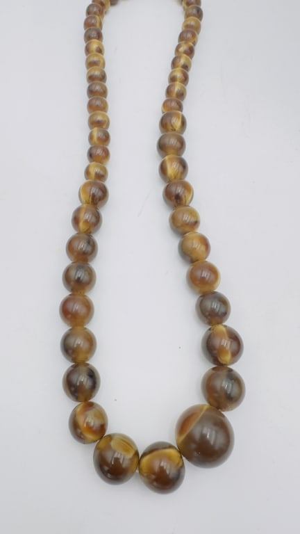 Graduated Bakelite Bead Necklace A vintage graduated necklace composed of round Bakelite beads in (1 of 3)