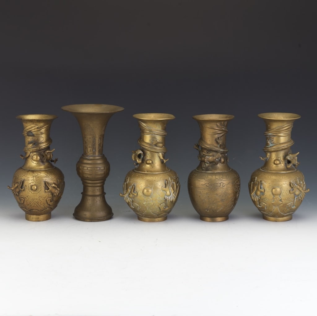 five Chinese brass temple vases, each of varying n five Chinese brass temple vases, each of varying: five Chinese brass temple vases, each of varying baluster and gu-form design five antique Chinese bronze vases, most likely dating from the late Qing Dynasty (19th century).Description:Material: Cast