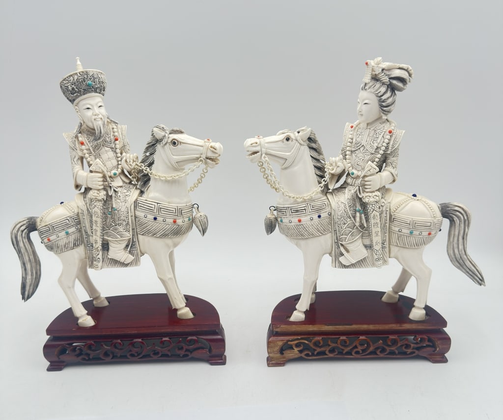 Pair of Chinese Carved Elephant Horse and Rider Figures A finely carved pair of Chinese: Pair of Chinese Carved Elephant Horse and Rider Figures A finely carved pair of Chinese elephant figures depicting a male and female rider mounted on horses. The figures are