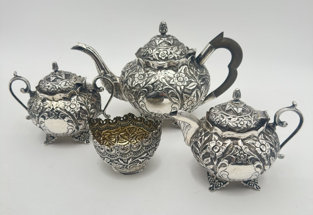 A decorative four-piece tea service featuring a teapot, lidded sugar bowl, creamer, and open (1 of 4)
