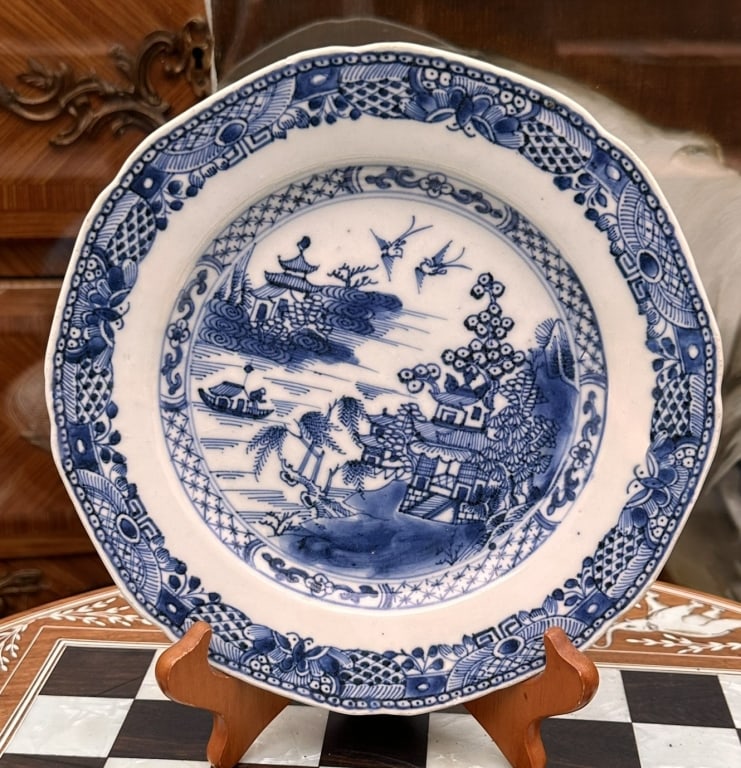 CHINESE BLUE & WHITE LANDSCAPE DISHE A finely painted blue and white porcelain plate decorated in: CHINESE BLUE & WHITE LANDSCAPE DISHE A finely painted blue and white porcelain plate decorated in underglaze cobalt blue with a romanticized river landscape featuring pavilions, willows, a bridge, and