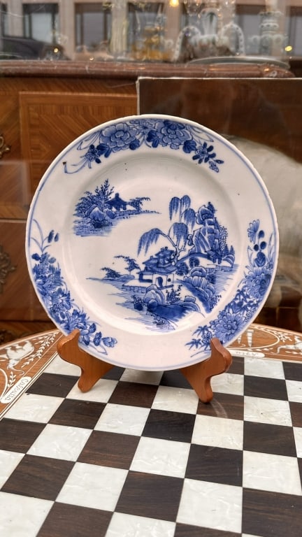 19th CHINESE BLUE & WHITE LANDSCAPE DISHE A finely painted blue and white porcelain plate: 19th CHINESE BLUE & WHITE LANDSCAPE DISHE A finely painted blue and white porcelain plate decorated in underglaze cobalt blue with a romanticized river landscape featuring pavilions, willows, a bridge