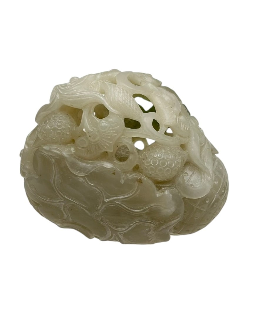 Chinese Carved Nephrite Jade Openwork Group with Fish and LotusFinely carved pale celadon nephrite: Chinese Carved Nephrite Jade Openwork Group with Fish and LotusFinely carved pale celadon nephrite jade featuring an elaborate openwork composition of fish swimming among lotus stems and seed pods. Th