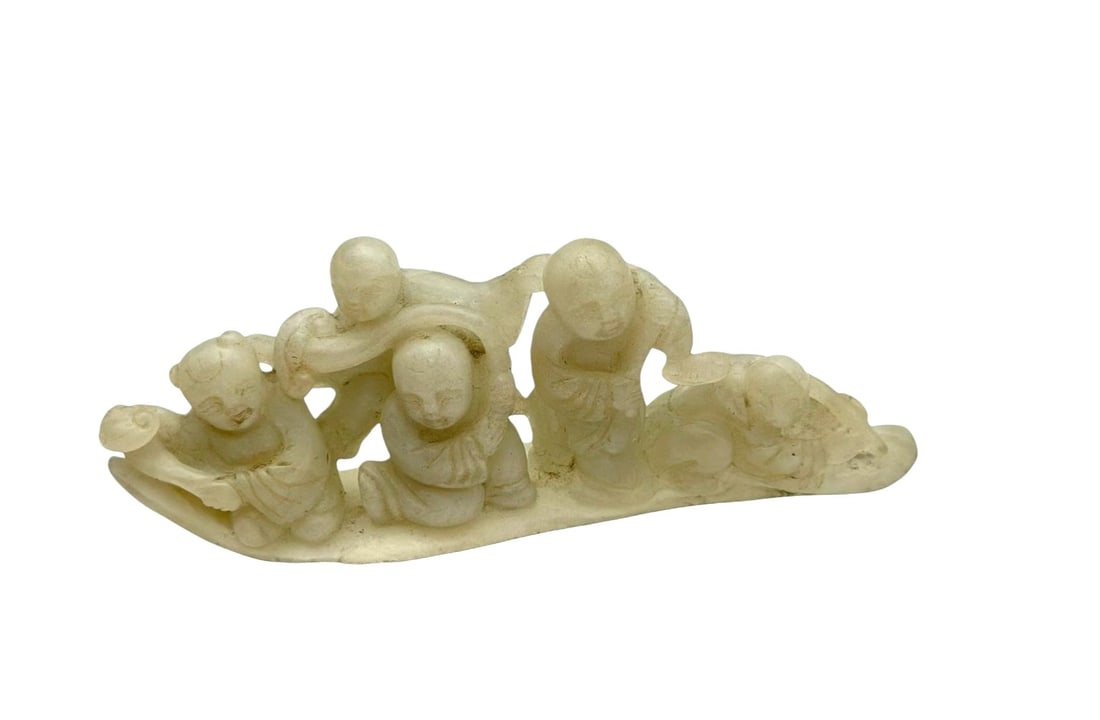 Chinese Carved Jade Group of Five Children (Wu Zi Deng Ke)Carved pale celadon jade sculpture: Chinese Carved Jade Group of Five Children (Wu Zi Deng Ke)Carved pale celadon jade sculpture depicting five playful children arranged in a lively group composition. The figures are shown interacting a
