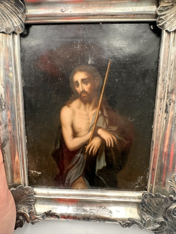 Christ as the Man of Sorrows with silver frameOil painting on metal panel, depicting Christ in a: Christ as the Man of Sorrows with silver frameOil painting on metal panel, depicting Christ in a solemn devotional pose against a dark ground. Executed with strong chiaroscuro and restrained coloratio