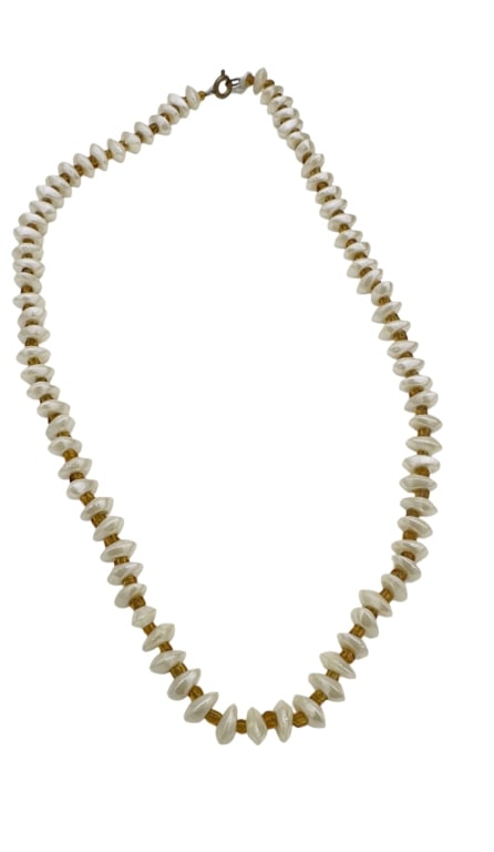 A delicate necklace composed of lustrous freshwater pearls, each with natural creamy-white: A delicate necklace composed of lustrous freshwater pearls, each with natural creamy-white iridescence, interspaced with amber-hued glass beads for contrast. The pearls are arranged in a uniform patte