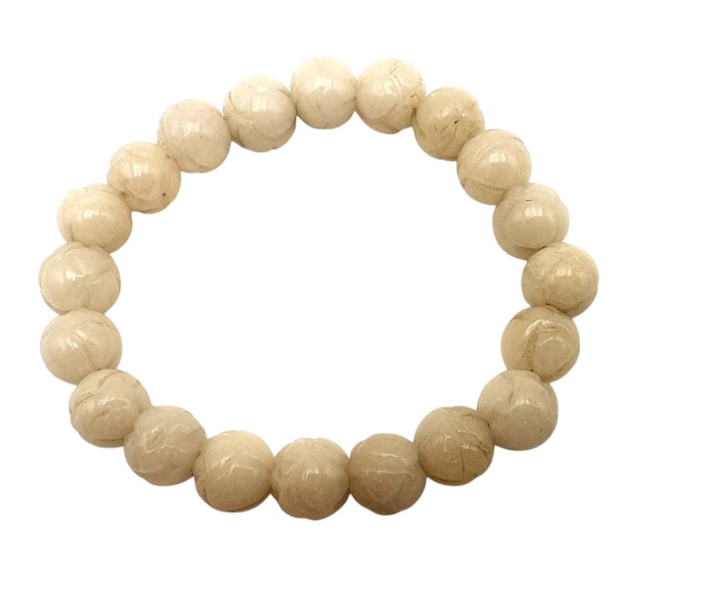 Chinese Carved Jade Bead Bracelet, 20th CenturyComposed of eighteen melon-shaped pale jade beads,: Chinese Carved Jade Bead Bracelet, 20th CenturyComposed of eighteen melon-shaped pale jade beads, strung as a bracelet on elastic cord. The melon motif symbolizes fertility and prosperity in Chinese d