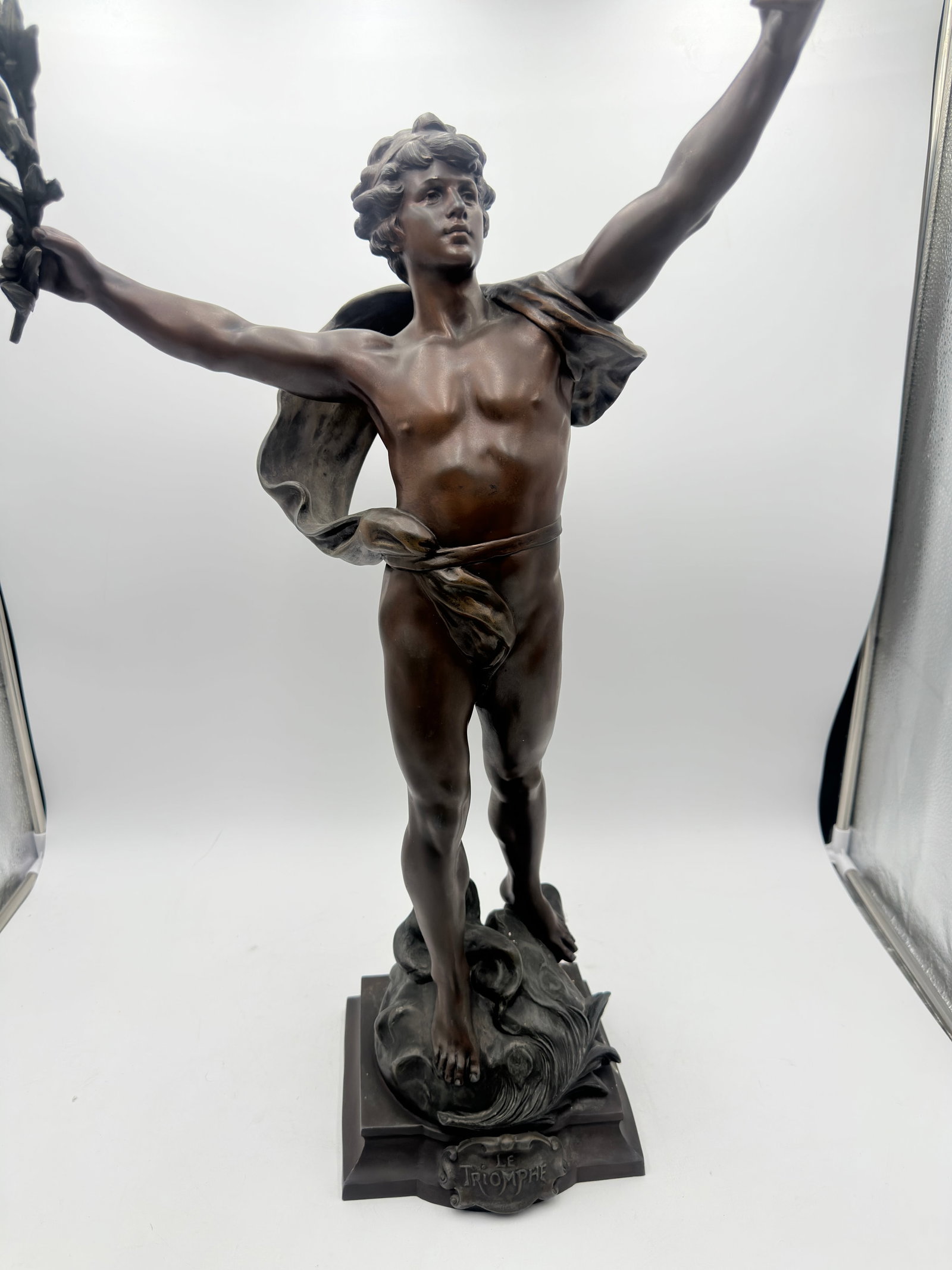 LOUIS AUGUST MOREAU (1855-1919) FRENCH. A FINE BRONZE FIGURE "LE TRIOMPHE" a classical young male ca: After Louis Auguste Moreau (French, 1855 - 1919): An early 20th Century spelter figure, Le TriompheSigned 'Louis Moreau, Salon Beaux Arts' to baseThe allegorical figure of victory modelled as a naked