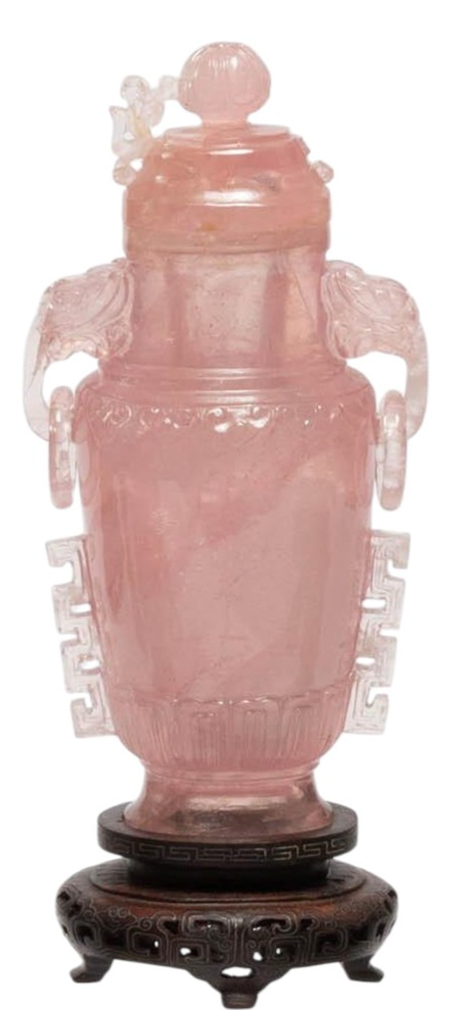 A Chinese carved rose Quartz covered vase of baluster form. The piece features a domed lid with: A Chinese carved rose Quartz covered vase of baluster form. The piece features a domed lid with finial, flanked by stylized handles with ring elements. The body is decorated with carved details includ