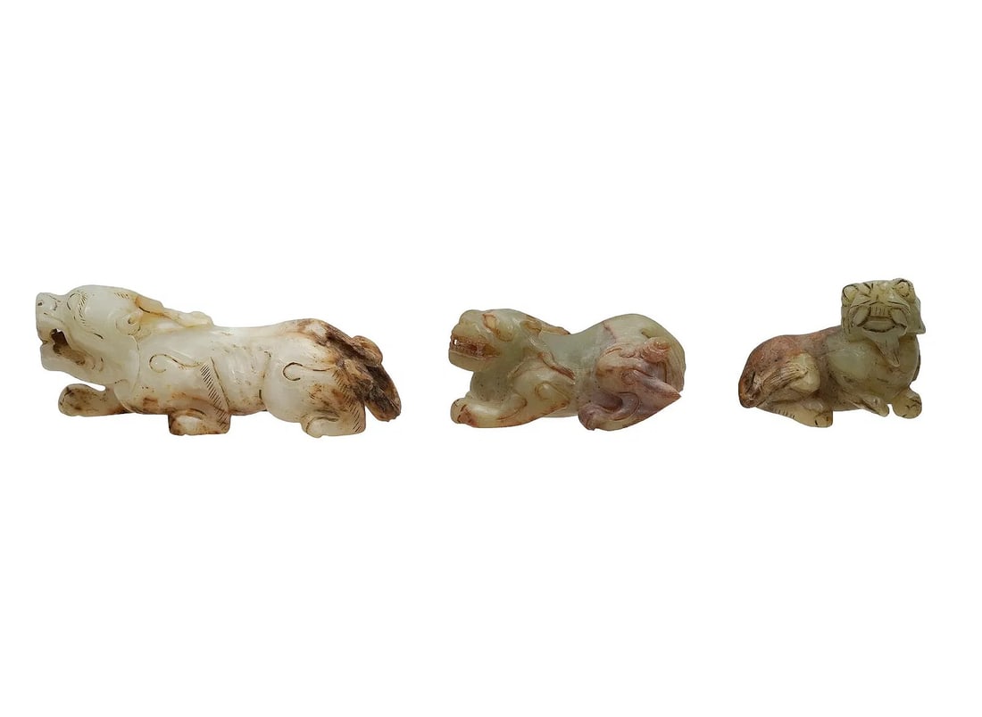 A LOT OF THREE CHINESE CARVED JADE QILIN FIGURES ? Qing Dynasty A charming pair of Chinese jade (1 of 3)