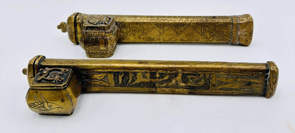 two Ottoman turkish Brass Qalamdan (Pen Case with Inkwell), 18th?19th Century A finely crafted: two Ottoman turkish Brass Qalamdan (Pen Case with Inkwell), 18th?19th Century A finely crafted Islamic brass qalamdan, featuring intricate hand-engraved calligraphy and floral arabesque designs throug