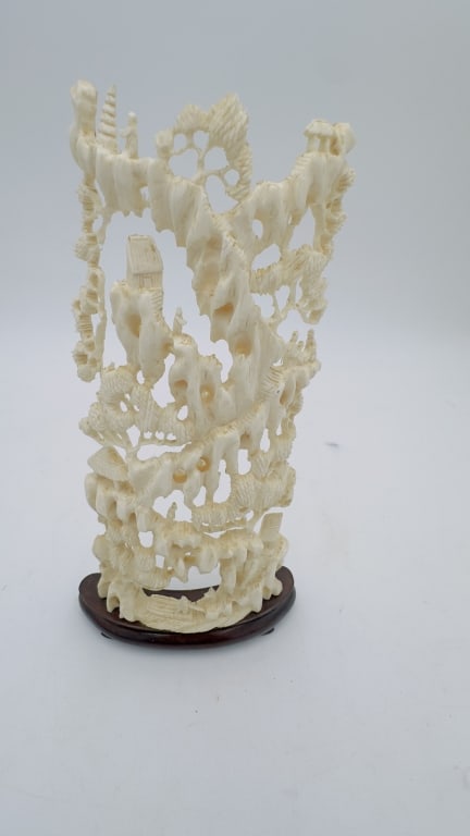 A finely detailed Chinese carved ivory landscape, intricately pierced and sculpted to depict (1 of 8)