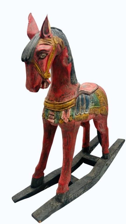 A vintage wooden rocking horse featuring a hand-painted finish. The horse is decorated in red with (1 of 3)