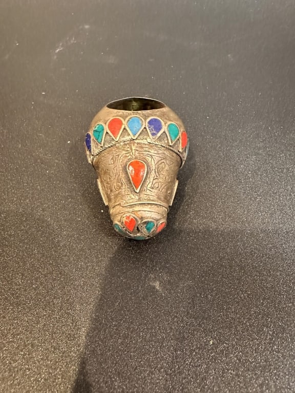 A vintage North African silver thimble decorated with colorful enamel in red, blue, and green (1 of 4)