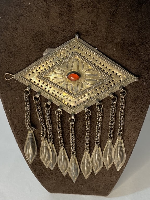 Turkmenistan, Late 19th century, partially silvered / carnelian / glass / mussels,: Turkmenistan, Late 19th century, partially silvered / carnelian / glass / mussels, diamond-shaped silver plates with filigree wire decoration, gold inlaid ation and carnelian trimming.For condition re