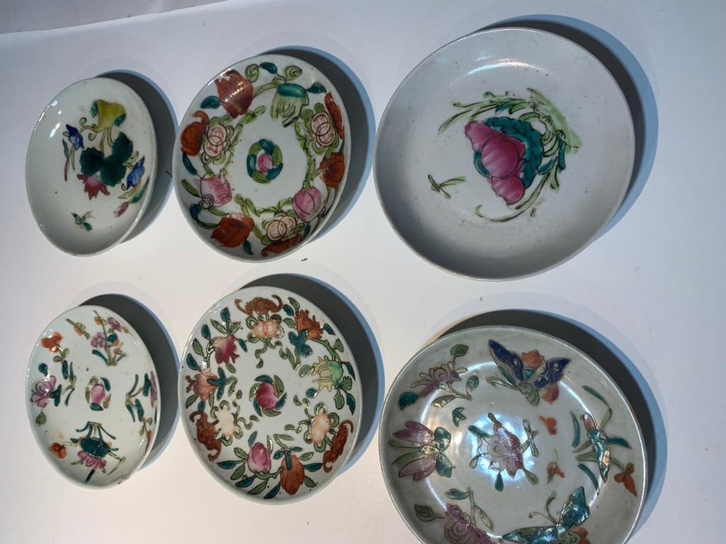 Set of Six Chinese Famille Rose Porcelain Saucers, Qing Dynasty (19th Century)Each decorated in: Set of Six Chinese Famille Rose Porcelain Saucers, Qing Dynasty (19th Century)Each decorated in polychrome enamels with floral sprays, peonies, and butterflies, in the famille rose palette. The