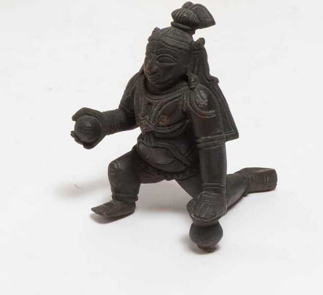 Indian Bronze Figure of Kneeling Deity An Indian bronze figure depicting a kneeling deity holding (1 of 3)