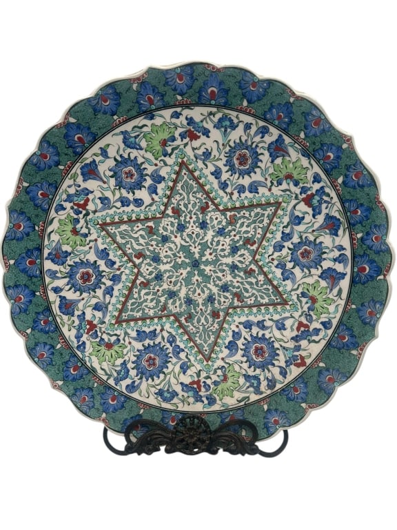 Turkish Iznik Style Ceramic Plate with Ship Decorn A decorative ceramic plate executed in the Iznik: A decorative ceramic plate executed in the Iznik style, featuring a central medallion depicting a stylized Ottoman sailing ship, surrounded by four panels of floral decoration including tulips and scr
