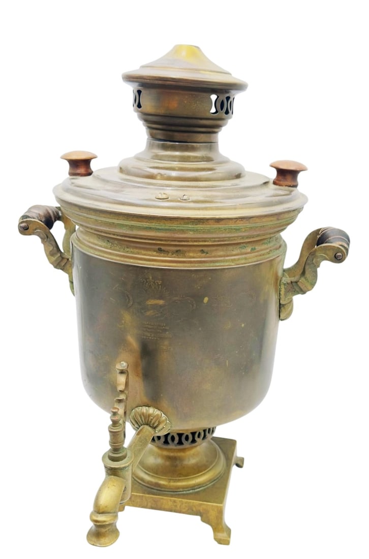 Antique Russian Brass Samovar, Batashov Factory, y An authentic Russian brass samovar of traditional: An authentic Russian brass samovar of traditional form, featuring twin side handles, a front spigot, and a domed lid with vented crown. The body is stamped with factory marks attributed to the renowne