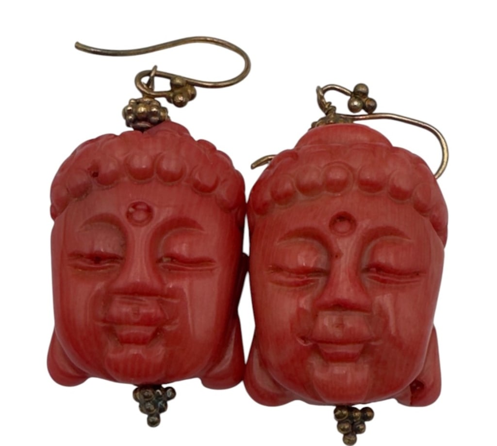 Pair of Carved Coral Buddha Head Earrings A pair of hand carved red coral earrings in the form of (1 of 2)