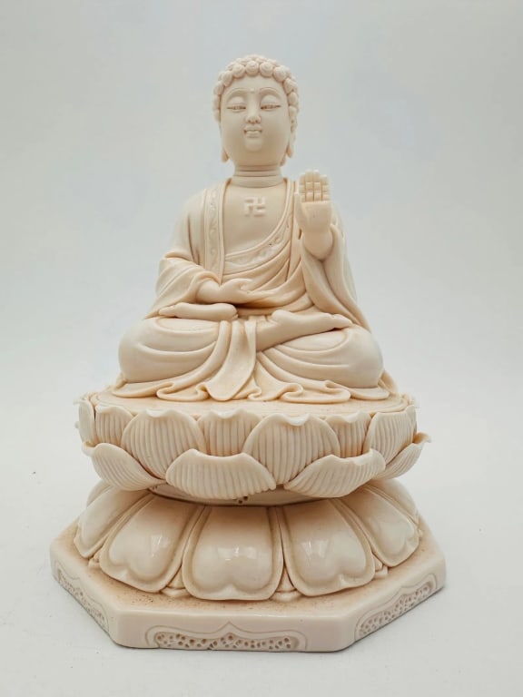Sculpture Sitting Sculpture Buddha Statue porcelan An elegant Chinese porcelain figure of a seated: An elegant Chinese porcelain figure of a seated Buddha, finely modeled with serene expression and graceful robes. The Buddha is depicted in the Abhaya mudra (gesture of protection) with the right hand