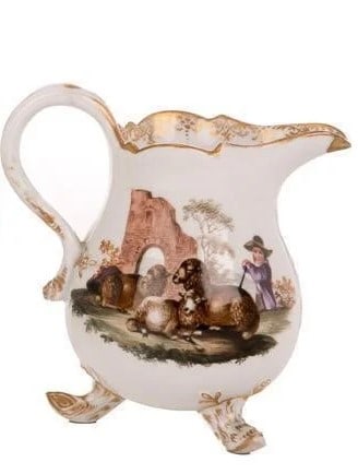 MEISSEN CREAM JUG Antique Meissen Porcelain Footed Cream Jug ? Hand-Painted Pastoral SceneA fine: Antique Meissen Porcelain Footed Cream Jug ? Hand-Painted Pastoral SceneA fine antique Meissen porcelain cream jug, richly hand-painted with a charming pastoral scene depicting a shepherd with sheep a
