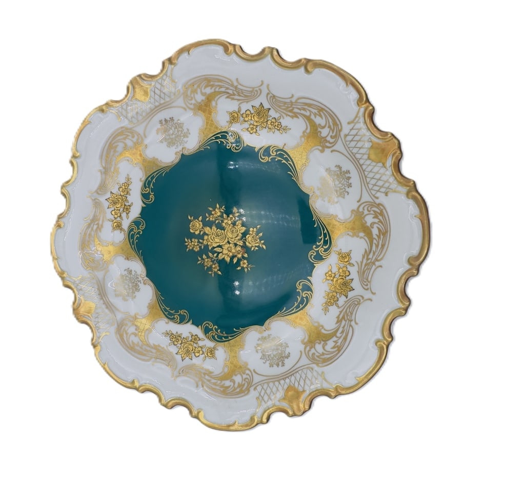 German Porcelain Cabinet Plate Fine German porcelain cabinet plate featuring an elegant scalloped: Fine German porcelain cabinet plate featuring an elegant scalloped form with richly gilt Rococo style decoration surrounding a deep turquoise center accented with gilt floral sprays. The border with e