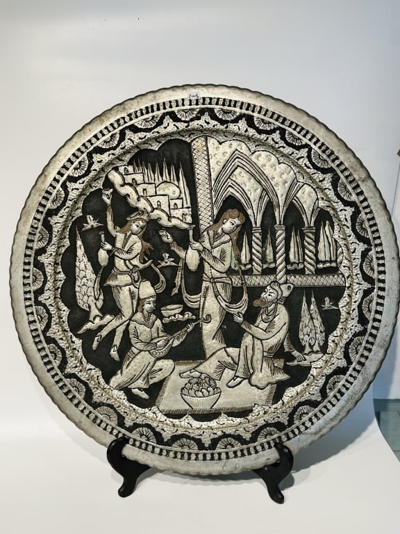 Large Qajar Silver-Inlaid Copper Tray, Persia, 19y An impressive Persian copper tray intricately ,: An impressive Persian copper tray intricately , depicting a royal courtly scene of musicians and attendants in an architectural setting. The composition features exquisite repouss? and chiseled