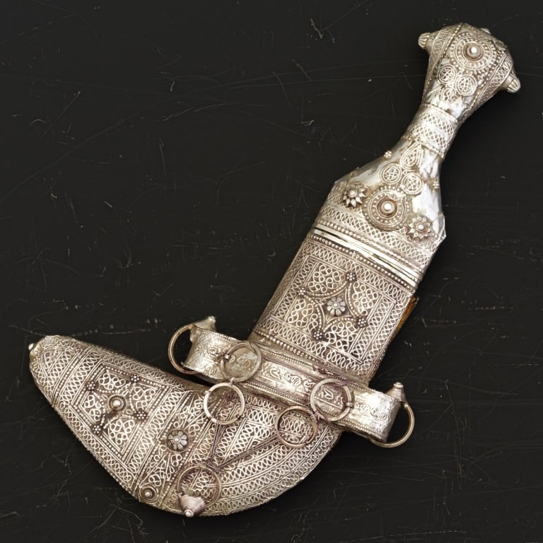 Omani Khanjar Traditional Silver Foil Overlay Curr Omani khanjar consisting of a curved, (1 of 8)
