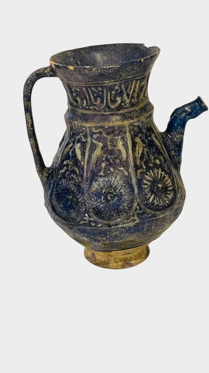 AN ISLAMIC BLUE-GLAZED POTTERY EWER, PERSIA, CIRCY An Islamic glazed pottery ewer, Persia, circa (1 of 8)