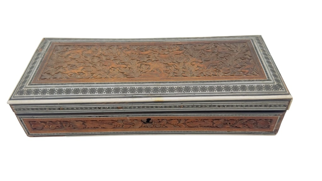 19th Century Anglo-Indian Vizagapatam Carved Sands A 19th century Anglo-Indian Vizagapatam carved: A 19th century Anglo-Indian Vizagapatam carved sandalwood box of rectangular form. The lid and sides are finely carved with detailed floral and animal motifs in relief. The borders are decorated with 